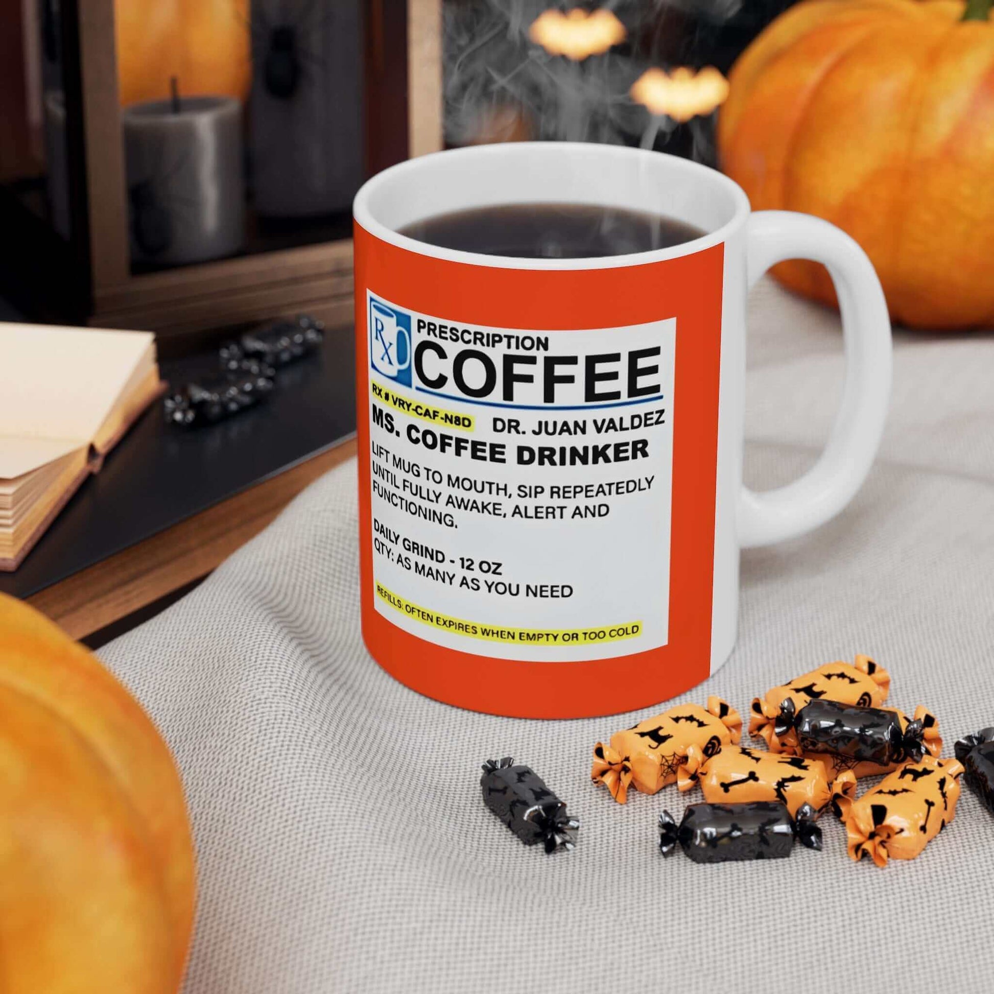 Prescription Coffee Mug for Her (11oz, 15oz) on a table with Halloween decorations