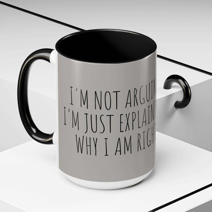 "Why I am Right Coffee Mug (11oz & 15oz) displaying bold text on a sleek glossy ceramic finish with black handle and interior."