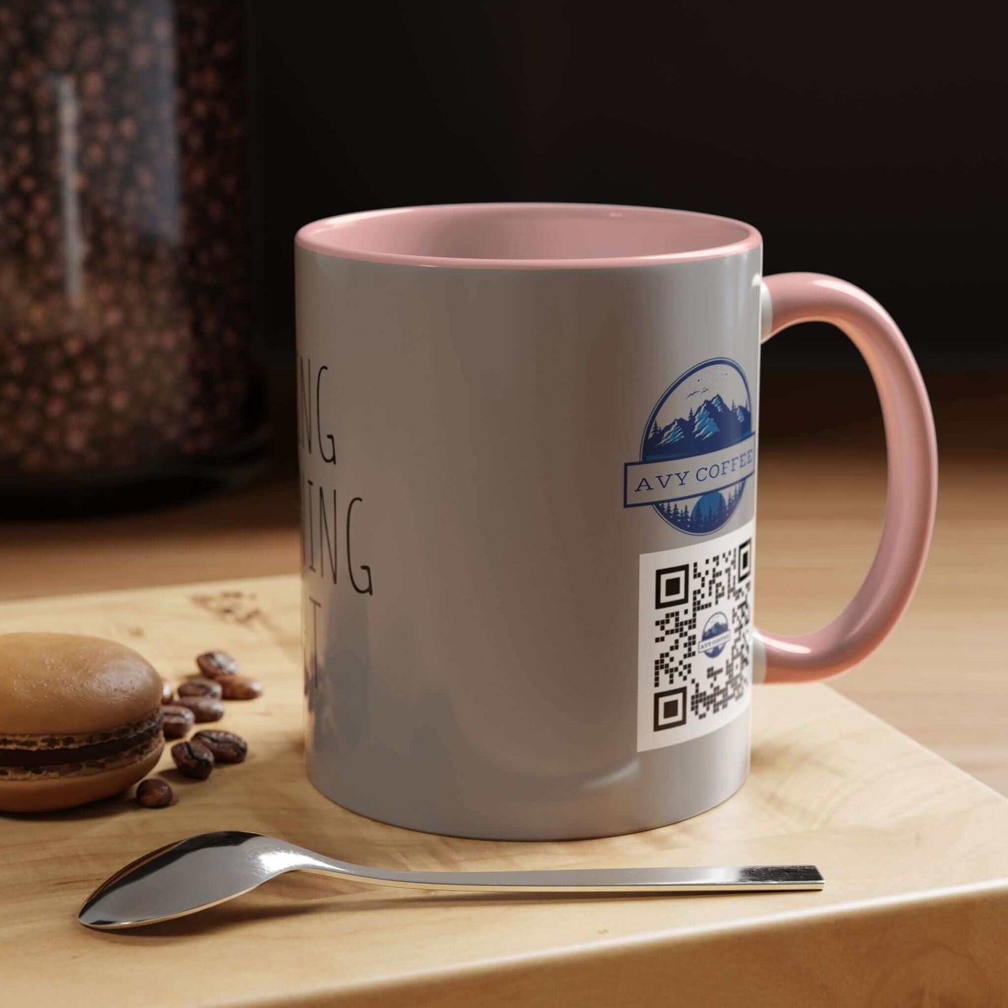 Why I am Right Coffee Mug (11oz & 15oz) showing sleek glossy finish, beside spoon and macaron, on wooden table with coffee beans in background.