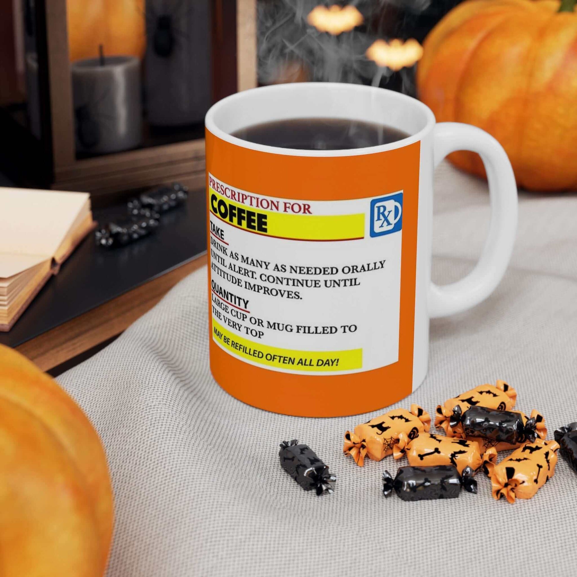 Prescription Coffee Mug filled with hot beverage, surrounded by Halloween decorations including pumpkins and candies.