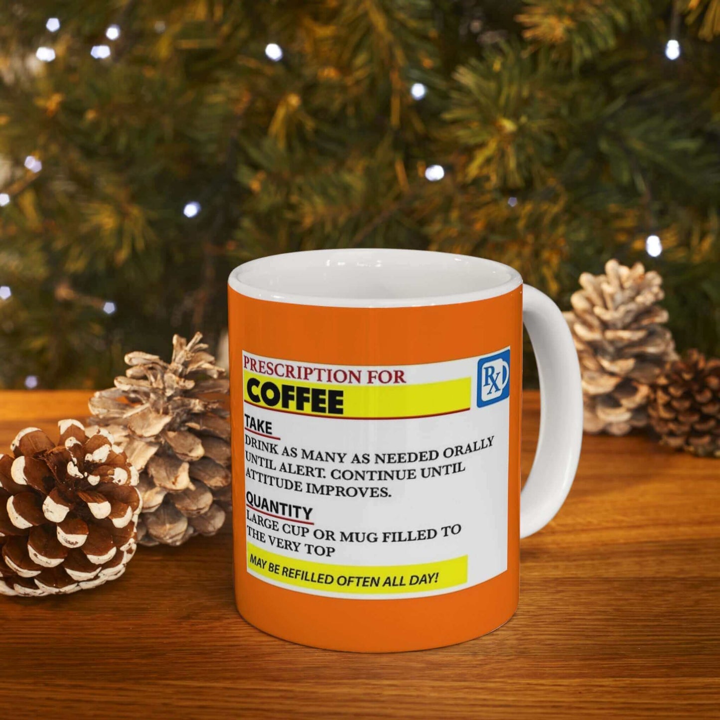 Prescription Coffee Mug on a wooden table with pine cones and holiday lights in the background.