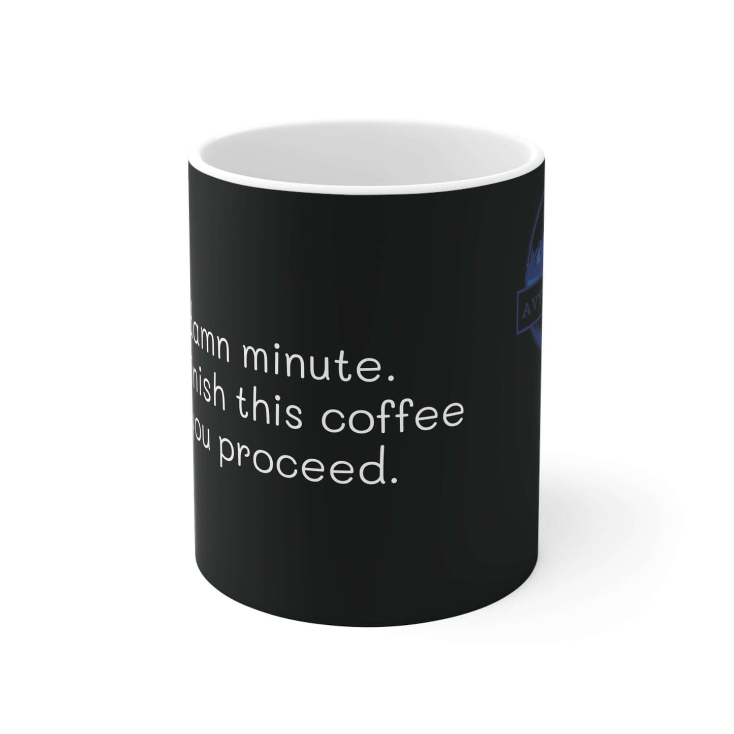 Black ceramic 11oz mug with "Wait a damn minute. Let me finish my coffee" printed in white letters on the side.