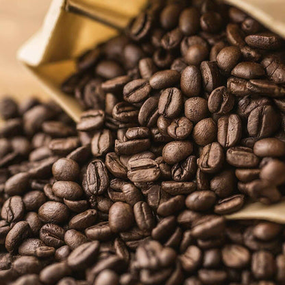 Rich chocolate hazelnut flavored coffee beans spilling onto a surface, highlighting the perfect balance of sweet and nutty aroma.